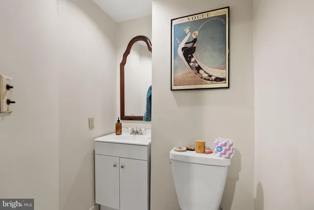 a room with a sink and a mirror