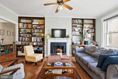 a living room with furniture fireplace and a flat screen tv