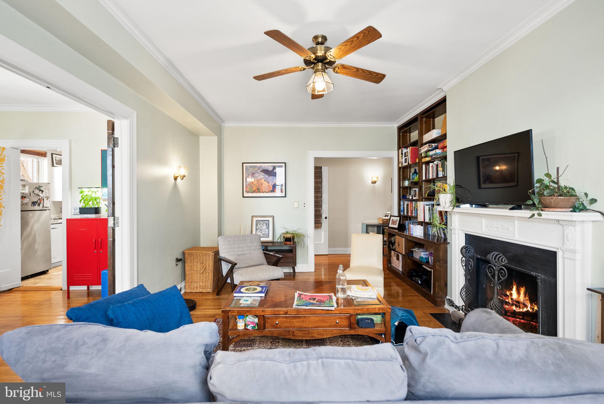 3405 Greenway, Unit 302 Baltimore, MD 21218 - Photo 10 of 42 a living room with furniture and a fireplace