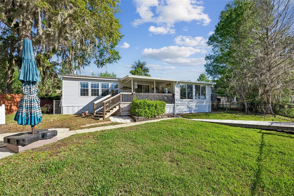 334 Paradise Circle Satsuma, FL 32189 - Photo 3 of 40 a view of a house with backyard and sitting area