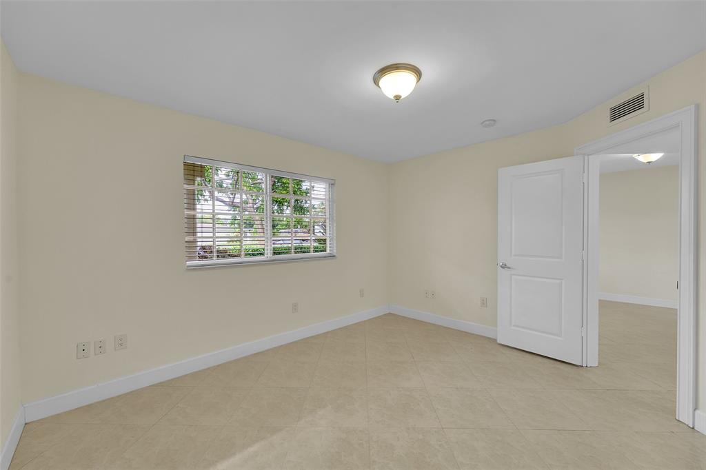 410 Southwest 15th Street, Unit 103 Pompano Beach, FL 33060 - Photo 11 of 16 an empty room with windows