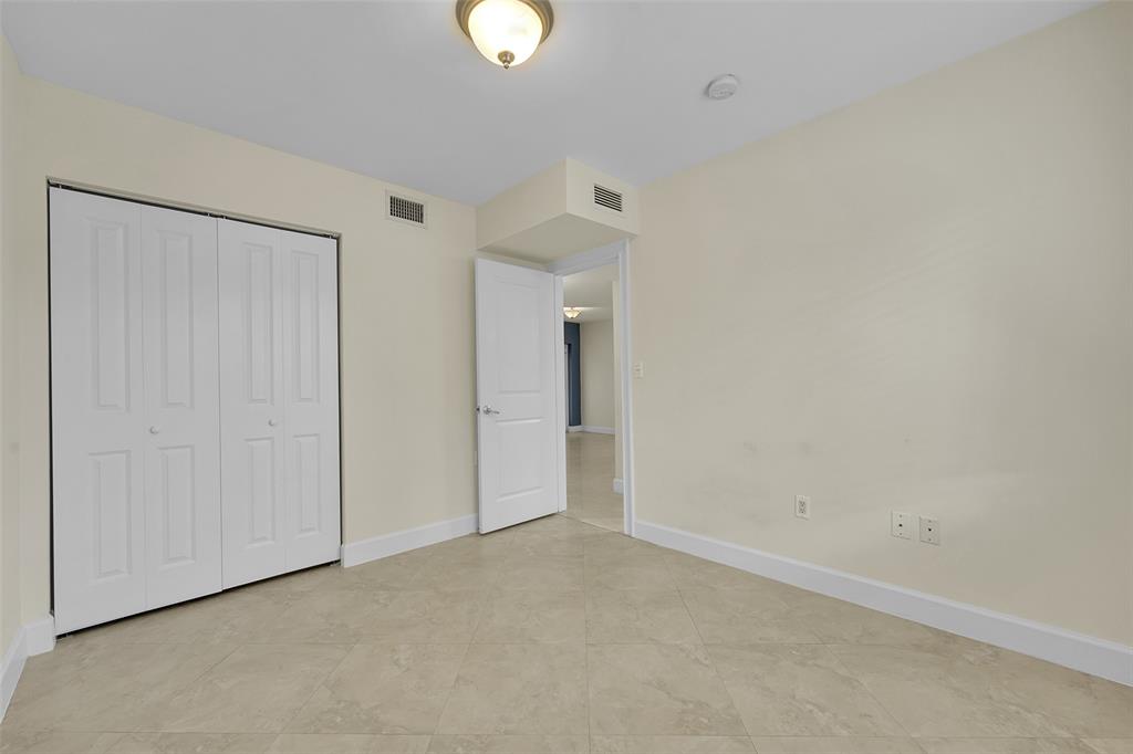 410 Southwest 15th Street, Unit 103 Pompano Beach, FL 33060 - Photo 14 of 16 a view of an empty room