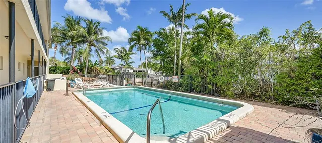 a view of a swimming pool with a patio