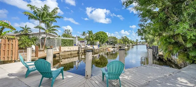 a view of a chairs and table in the patio