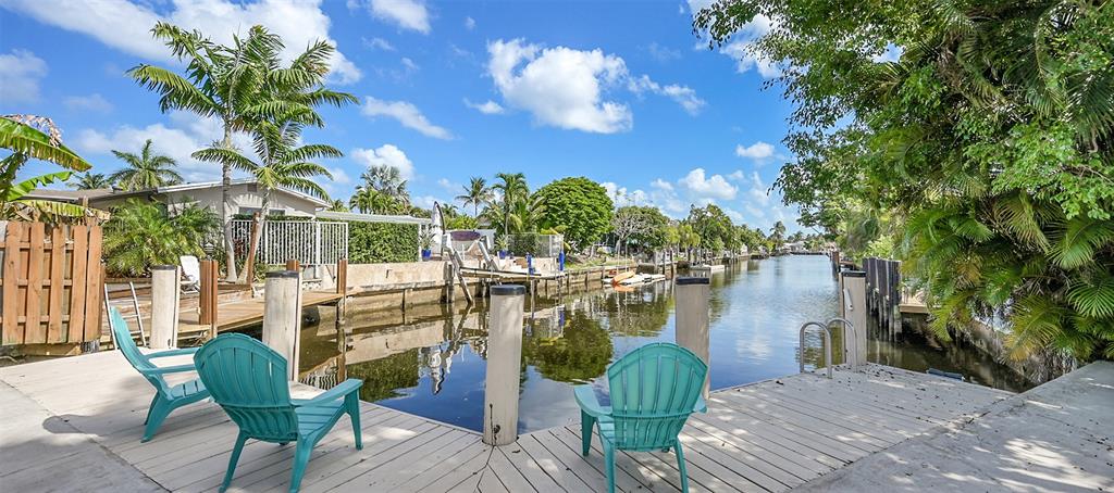 410 Southwest 15th Street, Unit 103 Pompano Beach, FL 33060 - Photo 16 of 16 a view of a chairs and table in the patio