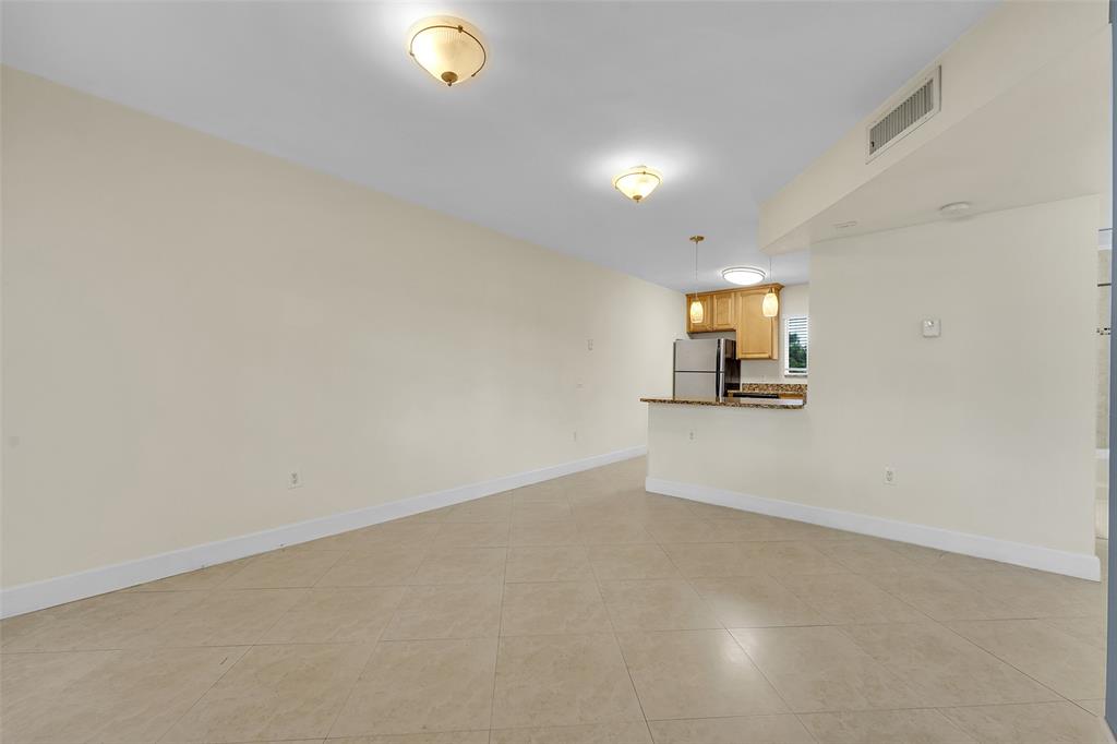 410 Southwest 15th Street, Unit 103 Pompano Beach, FL 33060 - Photo 4 of 16 a view of a room with a sink