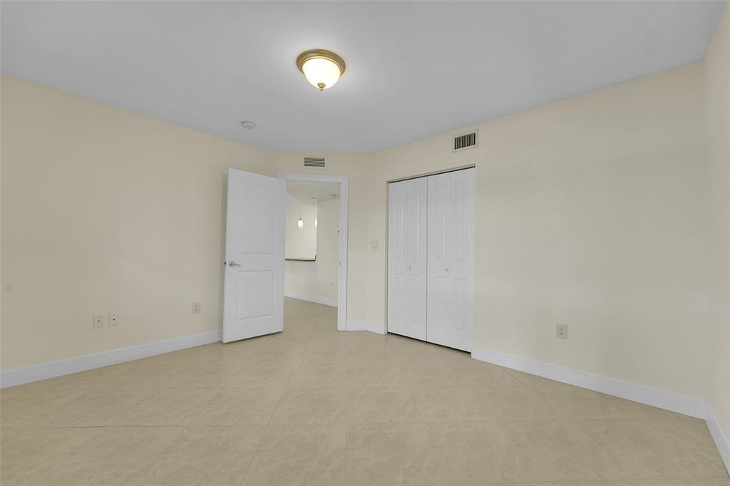 410 Southwest 15th Street, Unit 103 Pompano Beach, FL 33060 - Photo 10 of 16 a view of an empty room