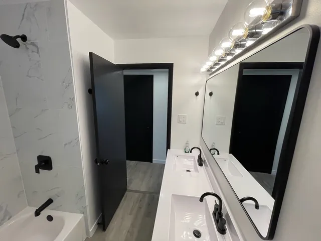 a bathroom with a sink and a mirror