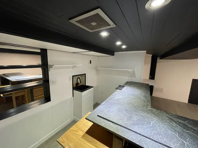 an empty room with wooden floor