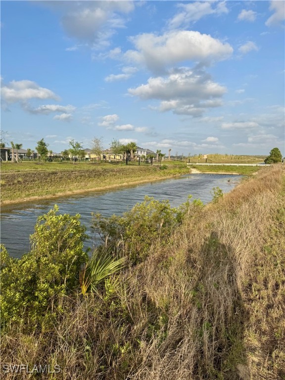 7500 Ruth Avenue North Lehigh Acres, FL 33971 - Photo 9 of 10 a view of an ocean and beach