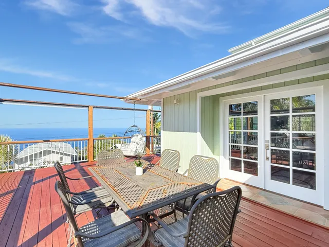 a bedroom with furniture a chandelier and a window