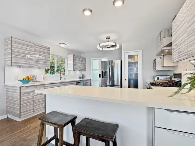 a room with a cabinet and a chandelier