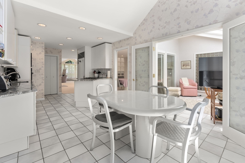 60 Whisper Drive Worcester, MA 01609 - Photo 11 of 39 a dining hall with stainless steel appliances a dining table and chairs