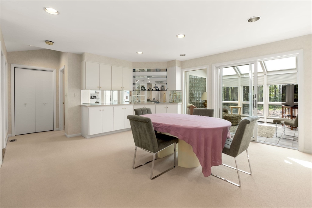 60 Whisper Drive Worcester, MA 01609 - Photo 17 of 39 a dining room with a wooden table and chairs