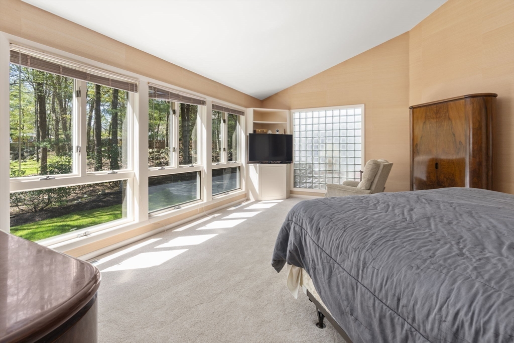 60 Whisper Drive Worcester, MA 01609 - Photo 20 of 39 a spacious bedroom with a large bed and large windows