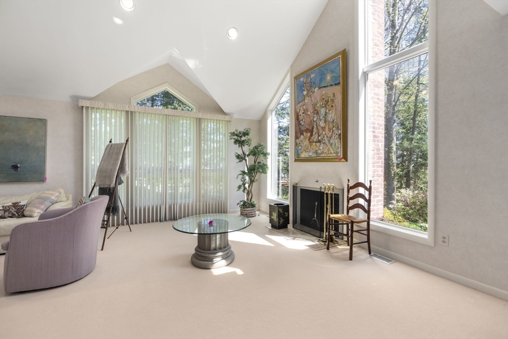 60 Whisper Drive Worcester, MA 01609 - Photo 2 of 39 a living room with furniture and a fireplace