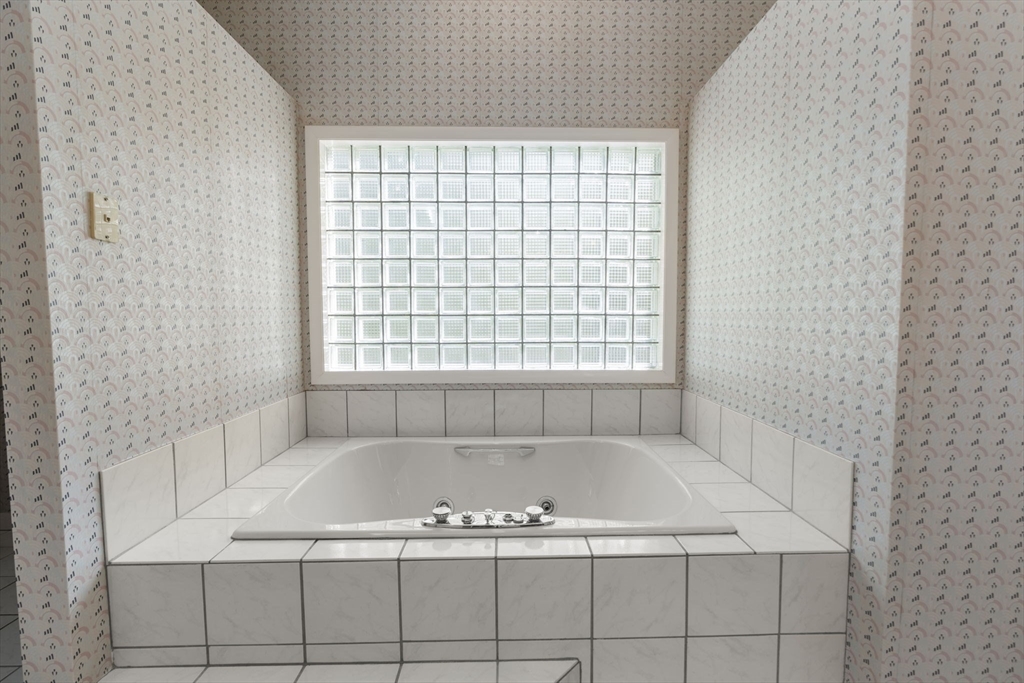 60 Whisper Drive Worcester, MA 01609 - Photo 22 of 39 a bath tub sitting in a bathroom next to a window