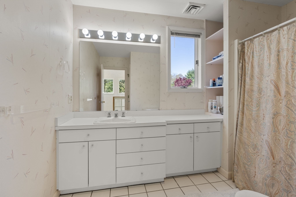 60 Whisper Drive Worcester, MA 01609 - Photo 27 of 39 a bathroom with a sink and a mirror