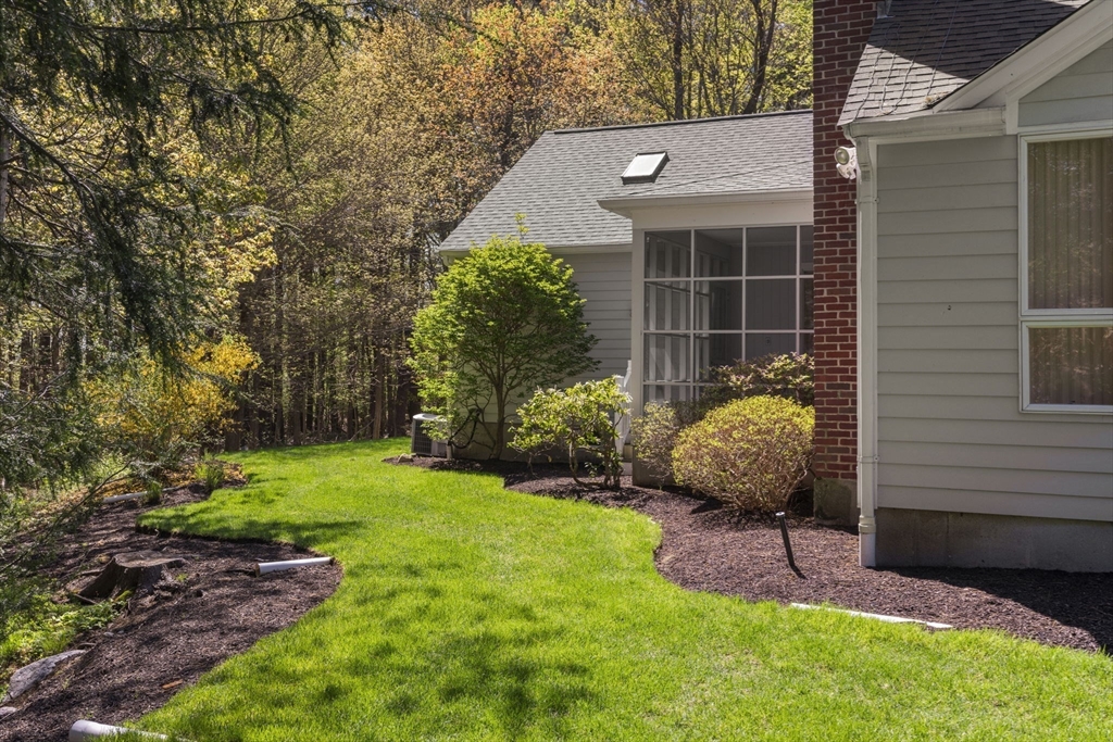 60 Whisper Drive Worcester, MA 01609 - Photo 34 of 39 a view of a chair and table in backyard of the house