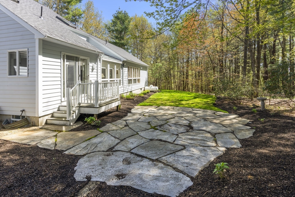 60 Whisper Drive Worcester, MA 01609 - Photo 36 of 39 a front view of a house with garden