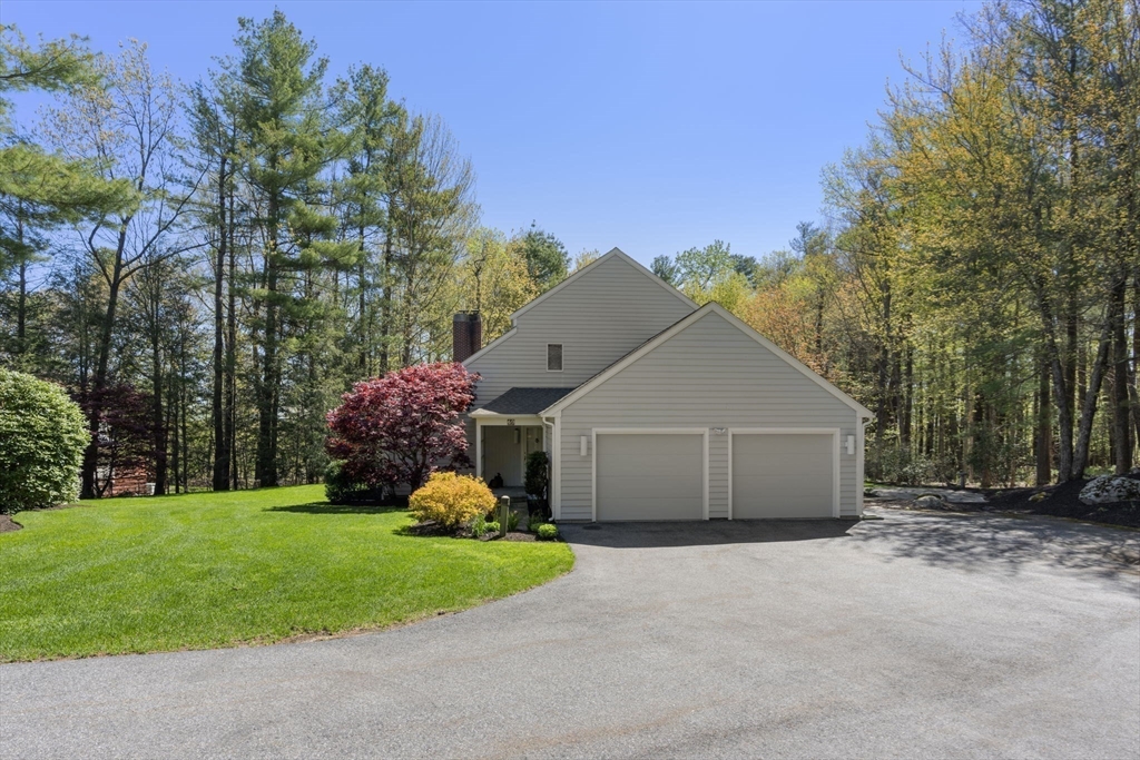 60 Whisper Drive Worcester, MA 01609 - Photo 4 of 39 a front view of a house with garden