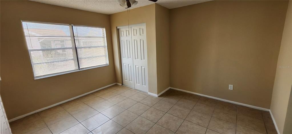 7452 Philatelic Drive Spring Hill, FL 34606 - Photo 32 of 45 an empty room with windows