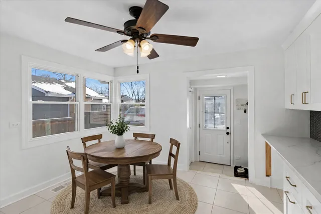 a dining room with furniture and window