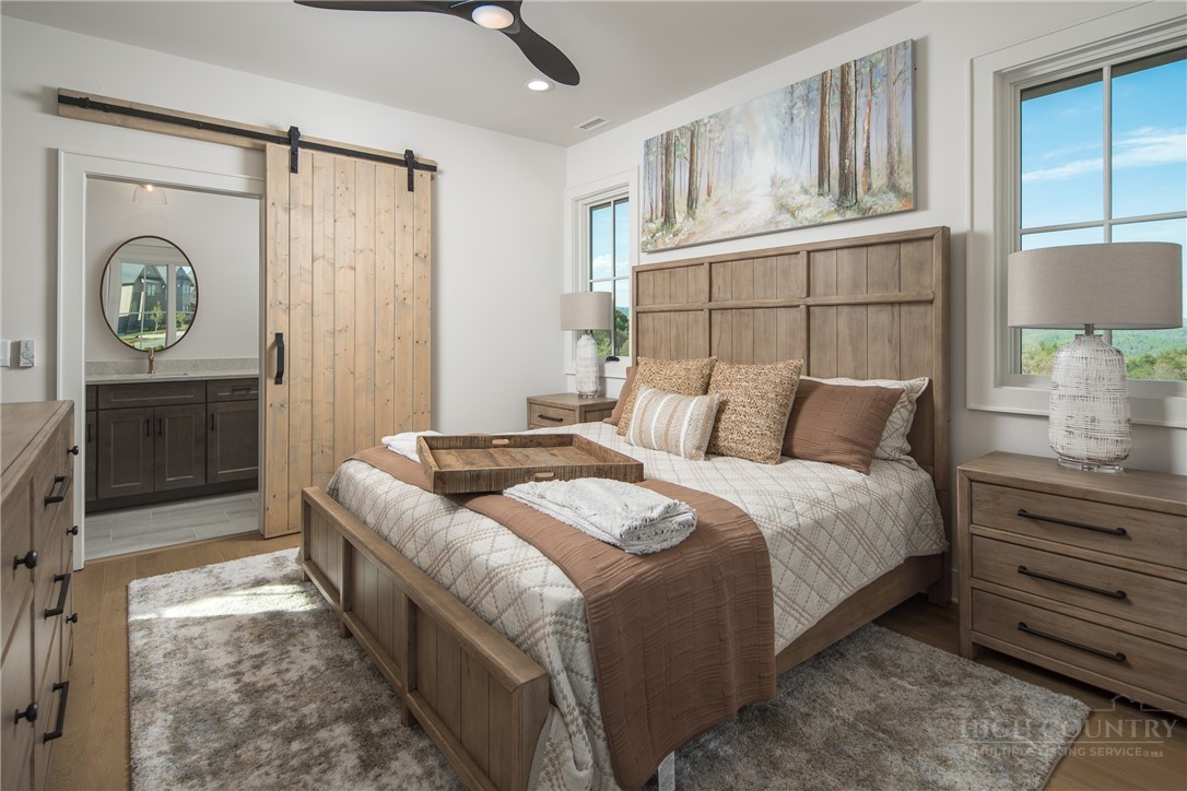 359 Calico Court Boone, NC 28607 - Photo 24 of 50 a bedroom with a bed and a closet with mirror