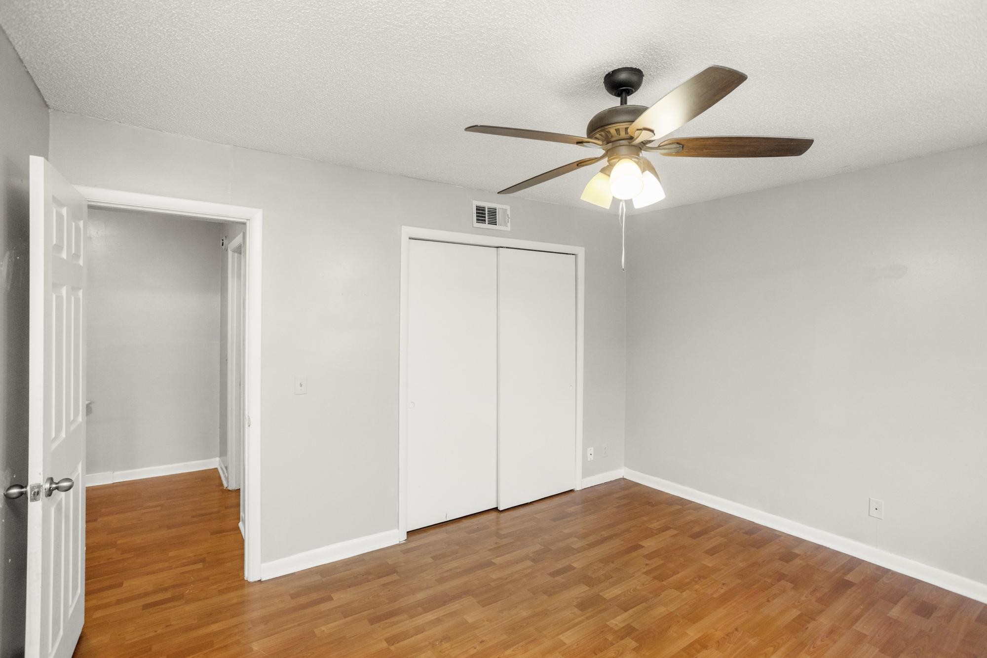 323 Forest Park Road Madison, TN 37115 - Photo 16 of 22 a view of empty room with wooden floor and fan