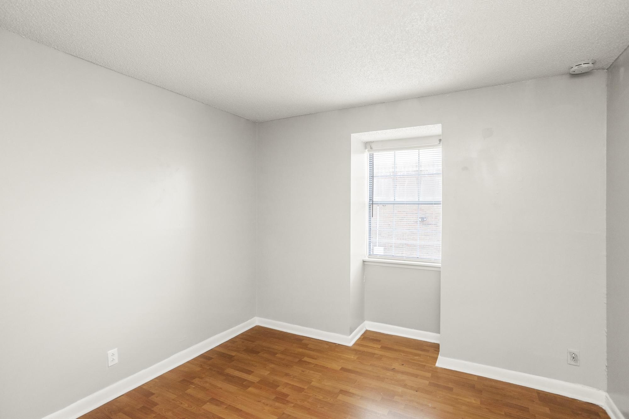 323 Forest Park Road Madison, TN 37115 - Photo 20 of 22 a view of an empty room with wooden floor and a window