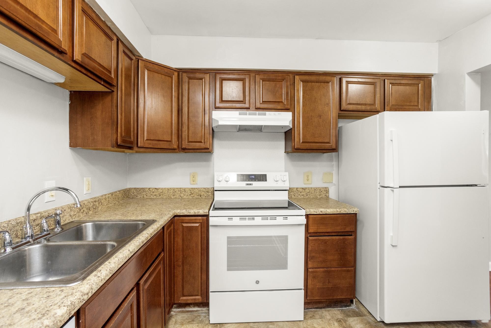 323 Forest Park Road Madison, TN 37115 - Photo 5 of 22 a kitchen with a refrigerator sink and cabinets