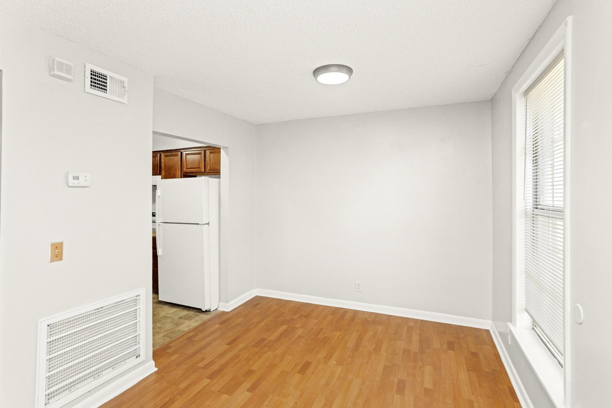 323 Forest Park Road Madison, TN 37115 - Photo 6 of 22 a view of empty room with wooden floor and fan