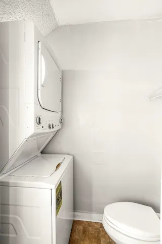a bathroom with a sink mirror vanity and toilet