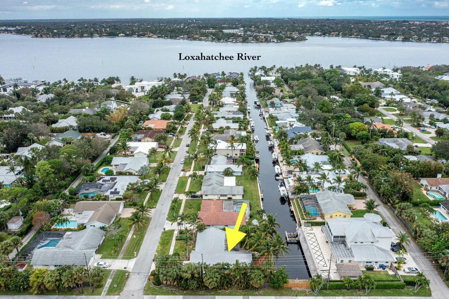 18014 Perigon Way Jupiter, FL 33458 - Photo 32 of 35 an aerial view of a residential houses with outdoor space and lake view