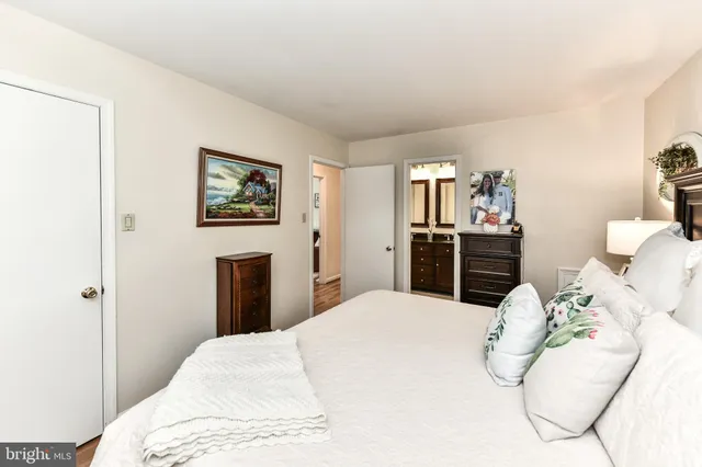 a bedroom with a bed and a dresser