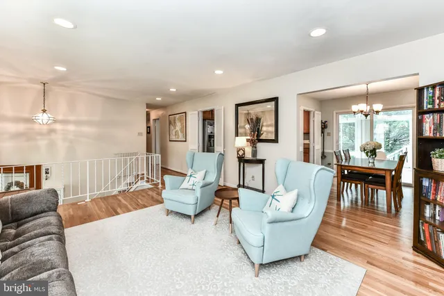 a view of a living room and a livingroom with furniture wooden floor