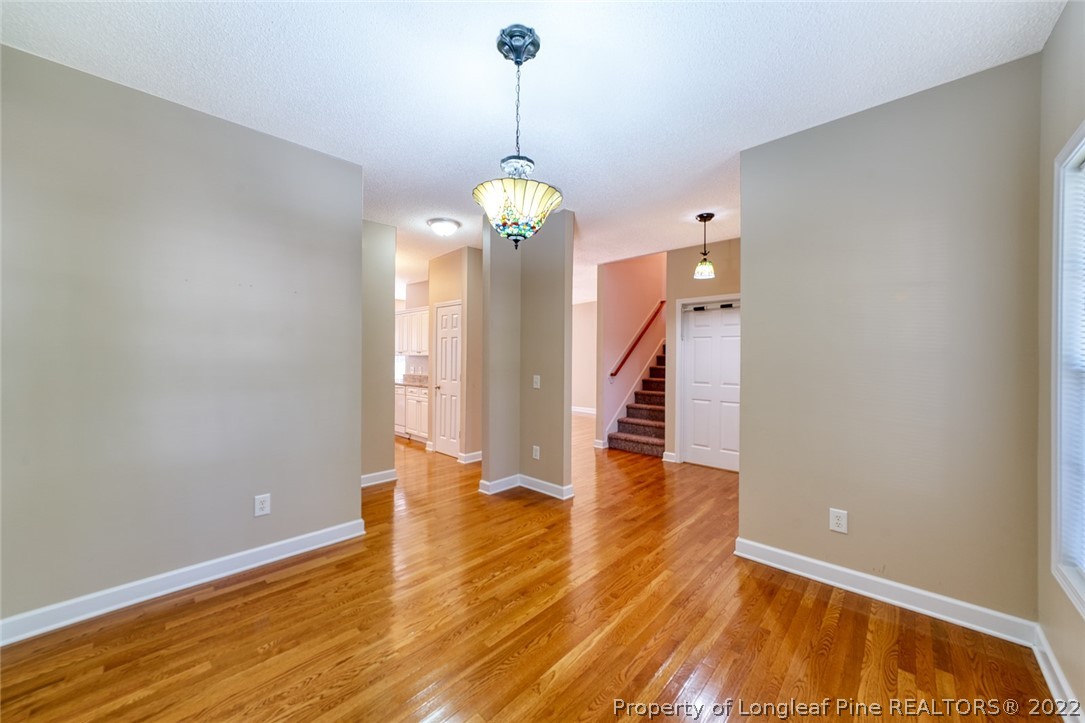 60 Spring Lake Drive Pinehurst, NC 28374 - Photo 11 of 38 a view of a room with wooden floor chandelier and entryway