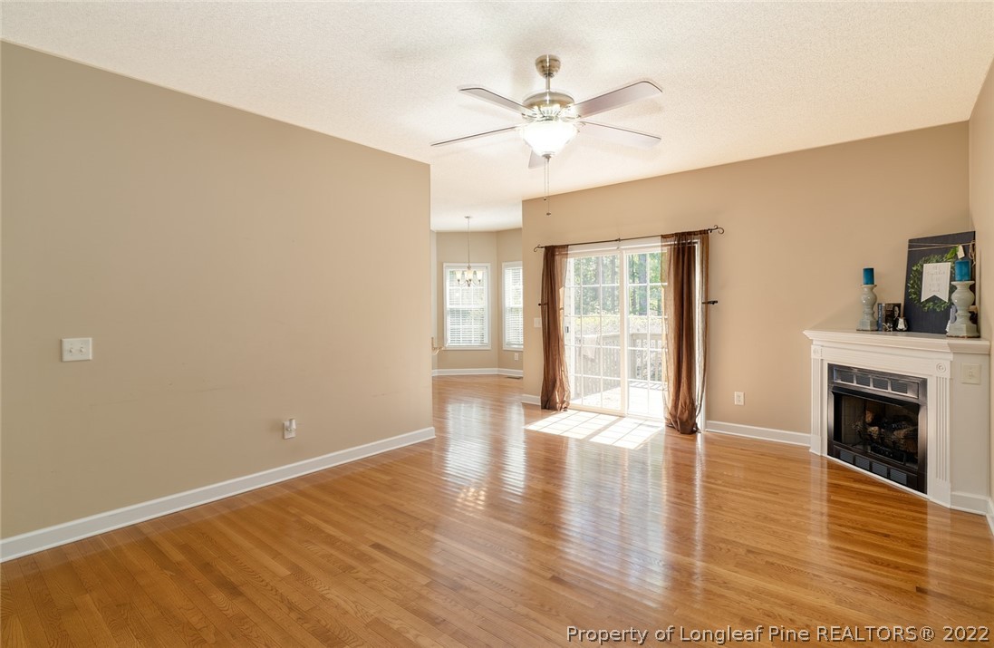 60 Spring Lake Drive Pinehurst, NC 28374 - Photo 12 of 38 a view of an empty room with wooden floor and a window