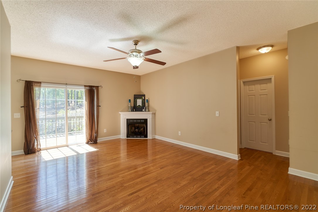 60 Spring Lake Drive Pinehurst, NC 28374 - Photo 13 of 38 a view of an empty room with wooden floor and a window