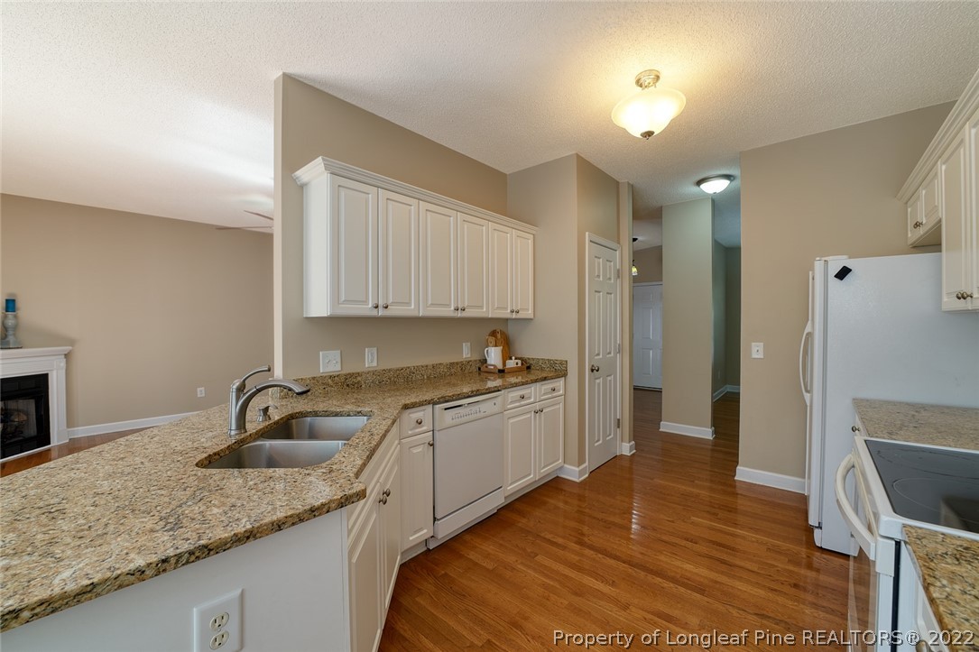 60 Spring Lake Drive Pinehurst, NC 28374 - Photo 17 of 38 a kitchen with a sink and cabinets