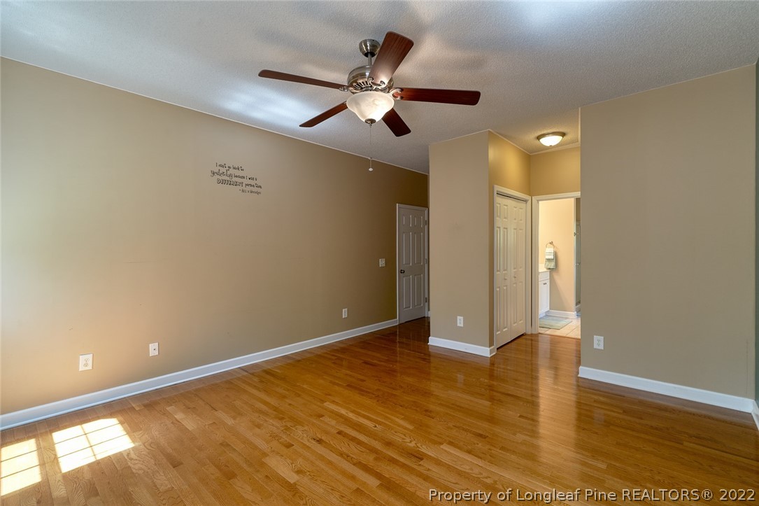 60 Spring Lake Drive Pinehurst, NC 28374 - Photo 22 of 38 wooden floor in an empty room with a window