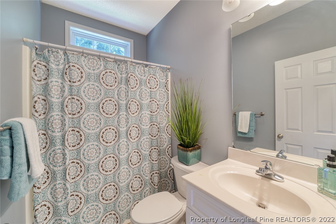 60 Spring Lake Drive Pinehurst, NC 28374 - Photo 28 of 38 a bathroom with a sink toilet and shower
