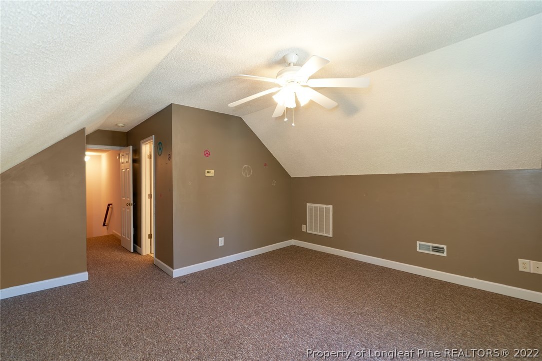 60 Spring Lake Drive Pinehurst, NC 28374 - Photo 30 of 38 an empty room with a ceiling fan and a window