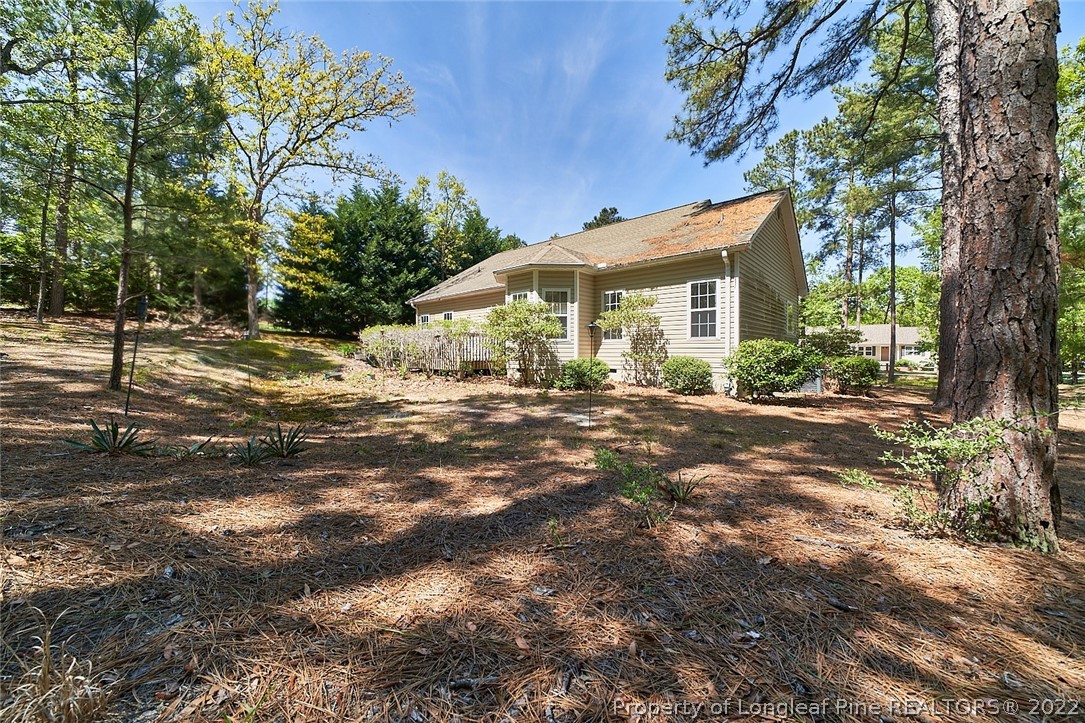 60 Spring Lake Drive Pinehurst, NC 28374 - Photo 37 of 38 a front view of a house with a yard