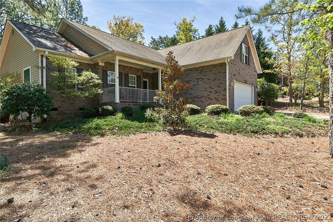 60 Spring Lake Drive Pinehurst, NC 28374 - Photo 5 of 38 a view of a house with a garden