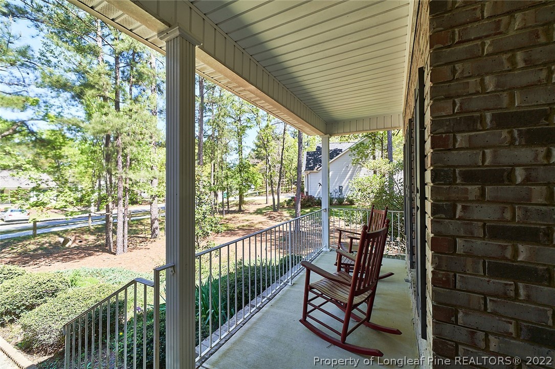 60 Spring Lake Drive Pinehurst, NC 28374 - Photo 6 of 38 a view of a porch with a table and chairs