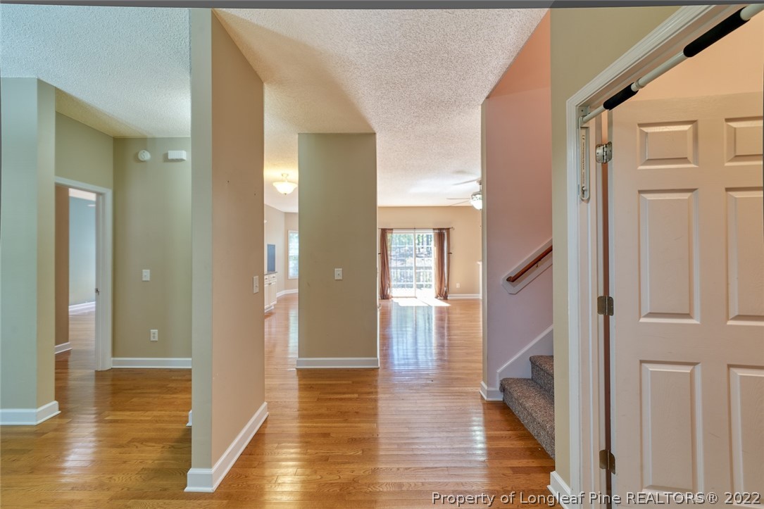 60 Spring Lake Drive Pinehurst, NC 28374 - Photo 7 of 38 a view of a hallway with wooden floor