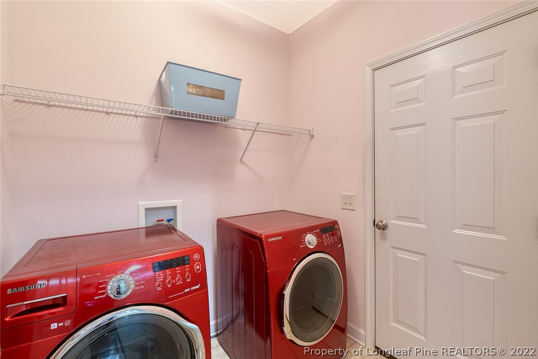 60 Spring Lake Drive Pinehurst, NC 28374 - Photo 8 of 38 a utility room with dryer and washer
