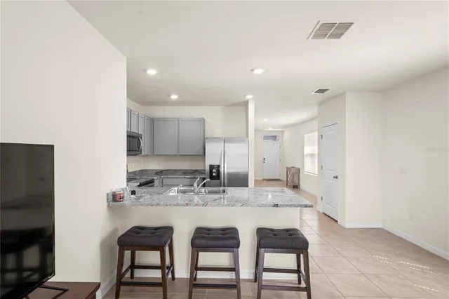 a view of hallway with livingroom and furniture