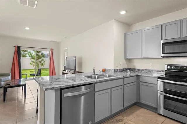 a bathroom with a shower curtain and a sink